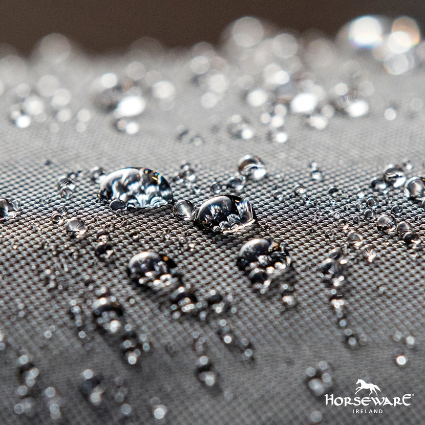 Horseware's Aquatrans water repellent technology showing beads of water on fabric